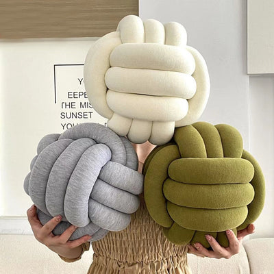 Bring luxury &amp; comfort to any room in your home with the Knotted Ball Throw Pillow! Crafted from 100% high-quality plush fabric, this pillow provides softness and superior support. Its unique knot ball shape makes it a statement piece for any interior décor. The sturdy stitching of this beautiful pillow adds to its durability &amp; styling
