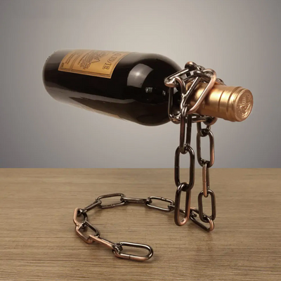 Share the atmosphere of luxury and sophistication at home or in your restaurant with the unique Magic Iron Chain Wine Bottle Holder. This stylish wine bottle holder is crafted from premium iron, creating an eye-catching chain-shaped display that effortlessly suspends your wine bottle in space.